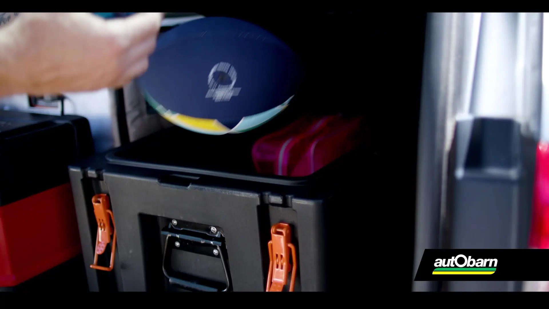 Still from the AdaptAd client portfolio reel: an Autobarn roof rack on a white SUV outside a Queenslander home
