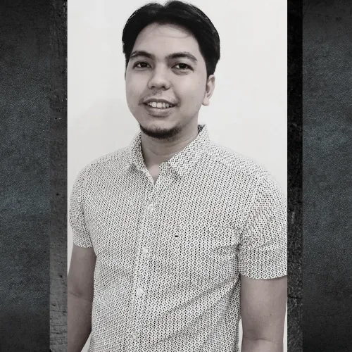 Marniel Torres of AdaptAd in a checked shirt, black and white portrait